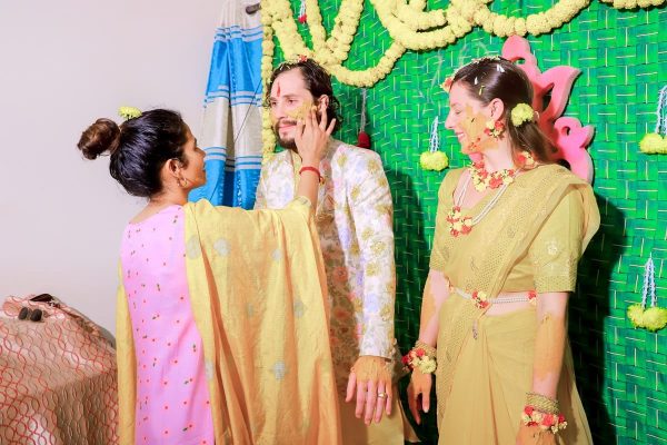 ⁠Nancy Gupta giving traditional tumeric ‘Haldi’ paste blessing